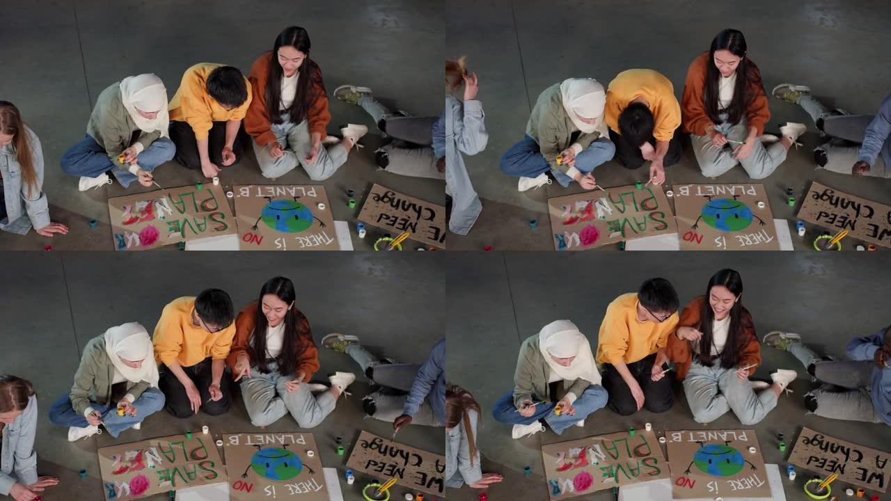 一群年轻人画海报抗议环境污染