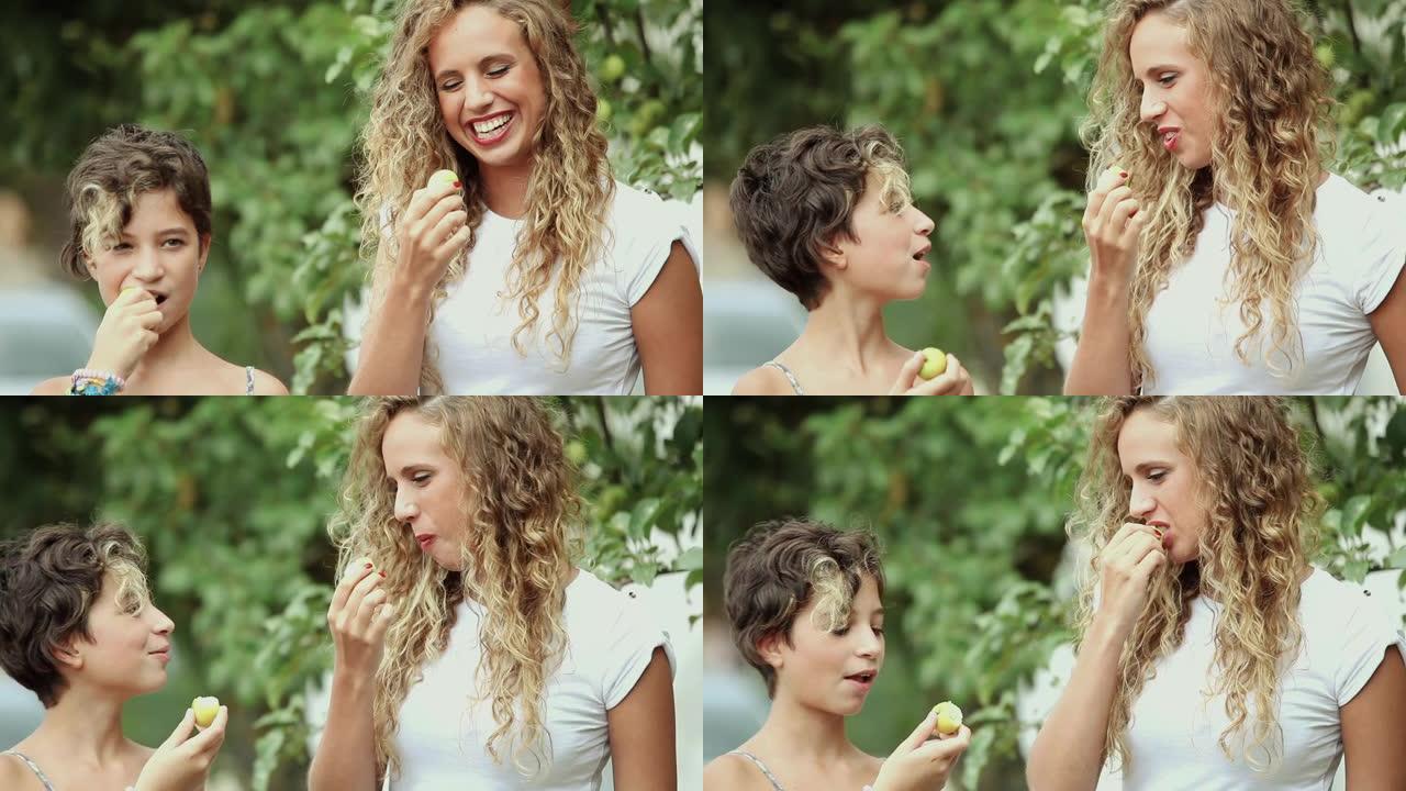 母女在户外吃苹果美好时光健康饮食母女