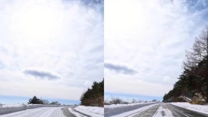 在雪山路上行驶