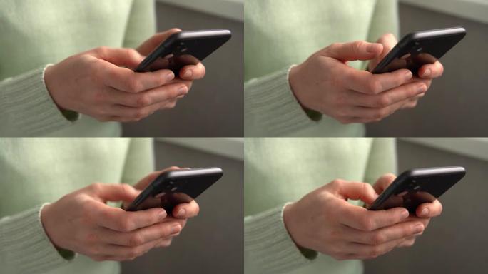 女人用iPhone 11智能手机按手指，阅读互联网，打字