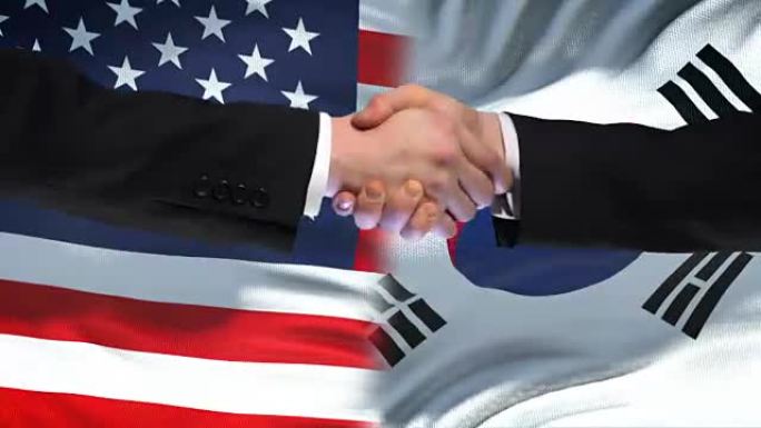 美国和韩国握手，国际友谊，国旗背景