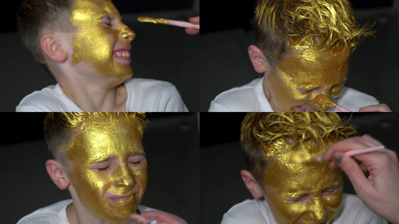 男孩的脸上涂着金漆。