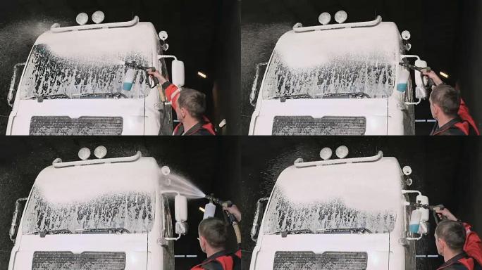 Workep慢速将清洁剂涂在卡车挡风玻璃上