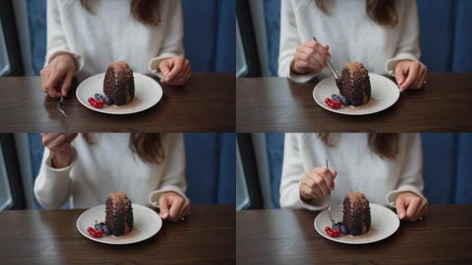 一个女人吃甜点的特写镜头