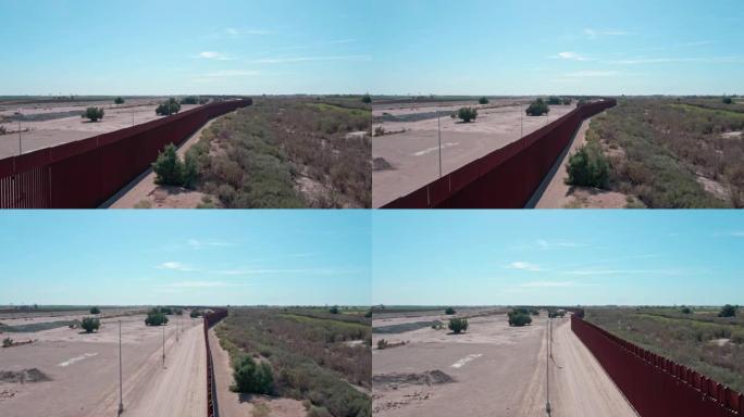 晴天，空中无人驾驶飞机在亚利桑那州尤马和墨西哥下加利福尼亚州北部的阿尔戈多内斯之间的边界墙