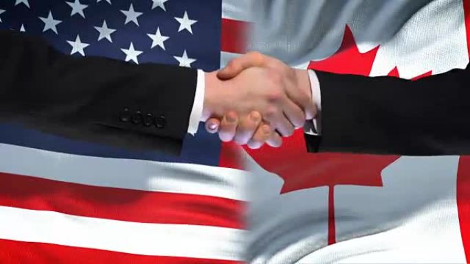 美国和加拿大握手，国际友谊，旗帜背景