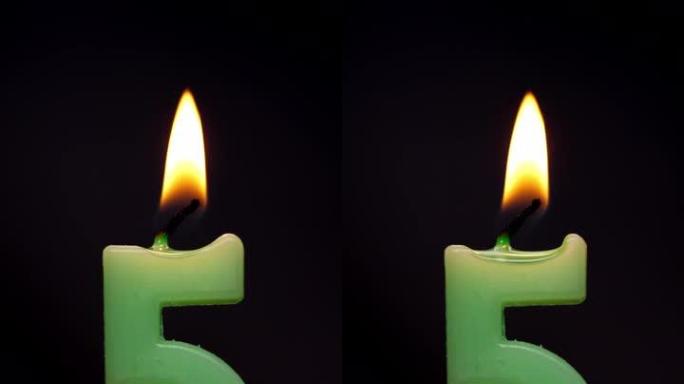 用火烧绿色蜡烛，生日蜡烛创意。