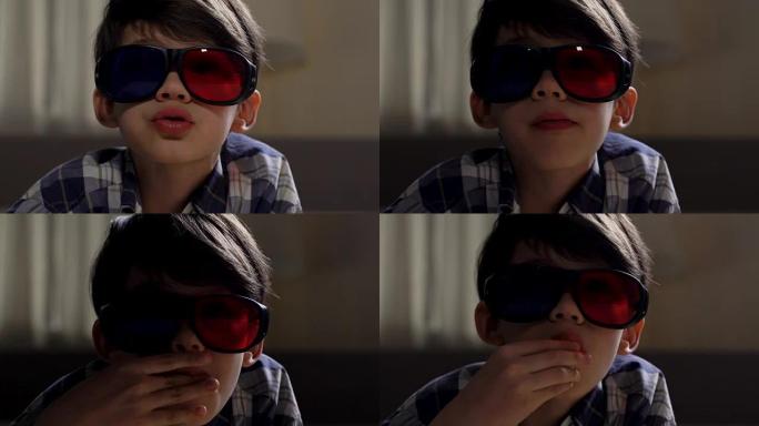 戴着3d眼镜的男生在家庭影院看电影并吃爆米花
