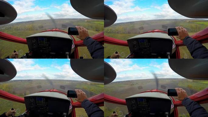 以快乐的视角拍摄运动飞机在智能手机上降落，极致