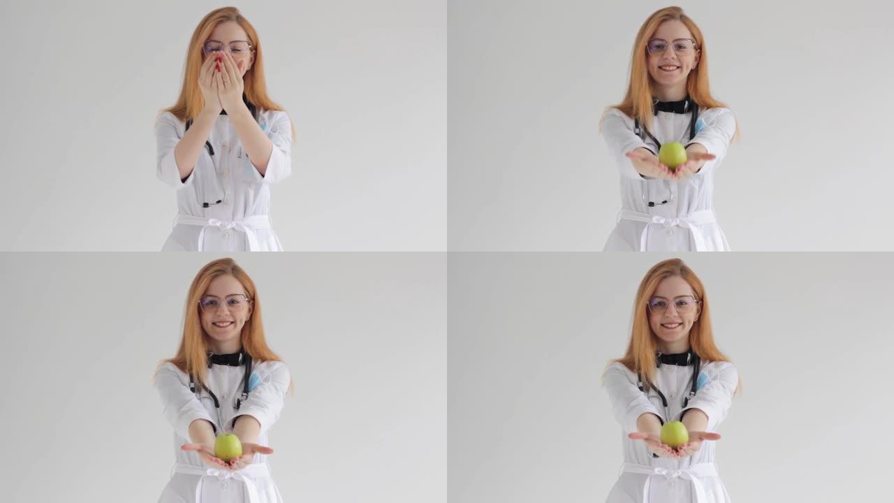 一位面带微笑的红发女医生手里拿着一个青苹果，提出了适当健康营养的概念。
