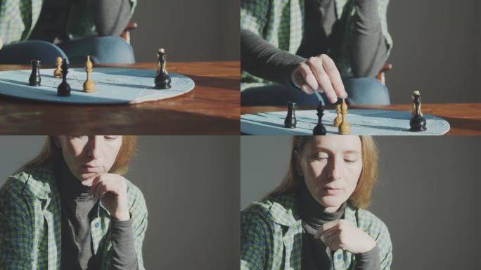 一个女人用图案在蓝色的圆形板上重新排列棋子。心理测试和人物类比。特写镜头上下移动