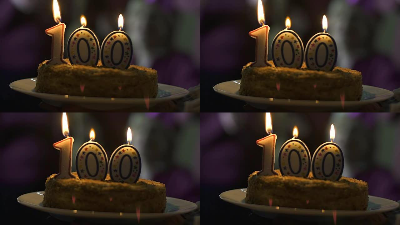 蜡烛在100周年纪念蛋糕上燃烧，订户数量，公司成功