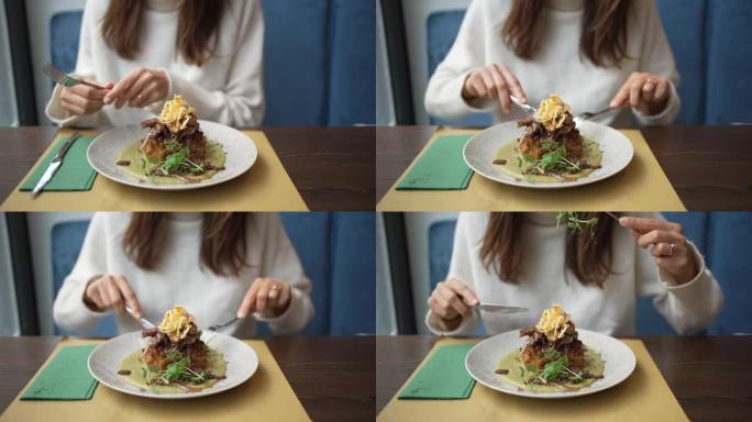 一个女人在吃精美的素食盘子的特写镜头