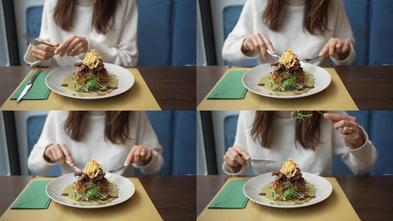 一个女人在吃精美的素食盘子的特写镜头