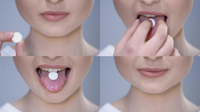 女人在舌头上放白色药丸，服用止痛药，维生素补充剂