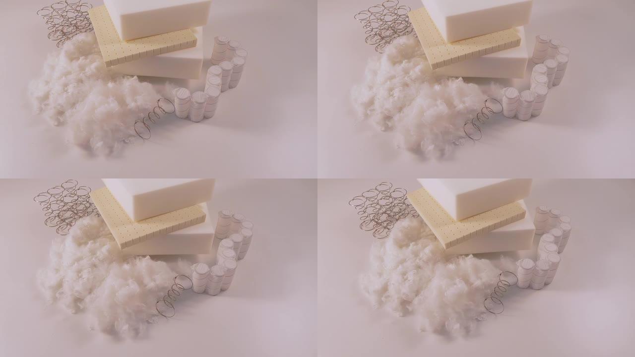 白色桌子上的海绵和棉布的弹簧。