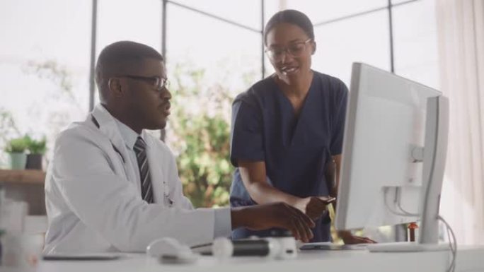 多民族医疗医院。专业的非洲裔美国护士和医生进行对话，使用计算机，讨论患者的治疗，药物或治疗
