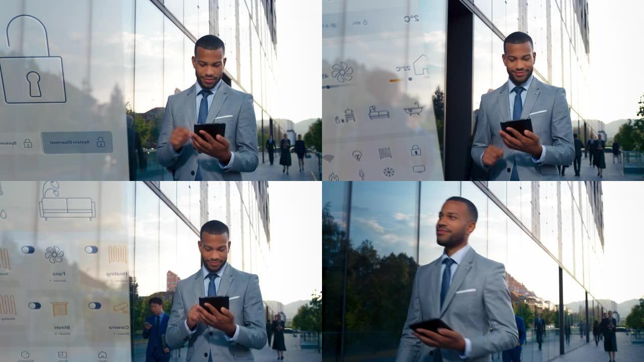 年轻的男性企业家在他的数字平板电脑上使用家庭控制应用程序，同时沿着现代商业大楼行走