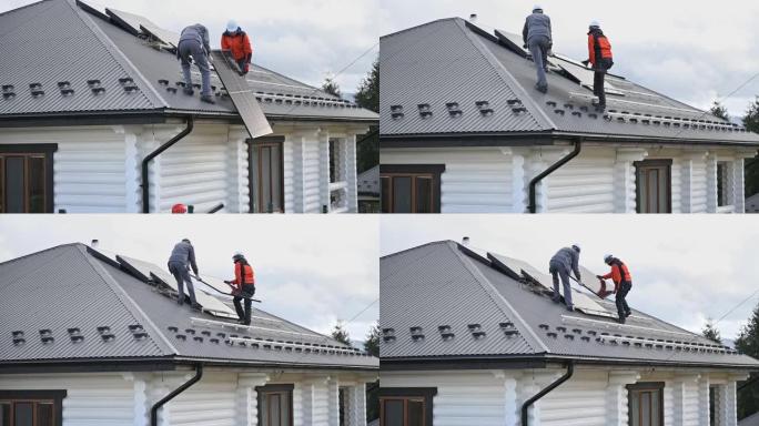 工人在屋顶安装太阳能电池板系统时抬起光伏太阳能组件。