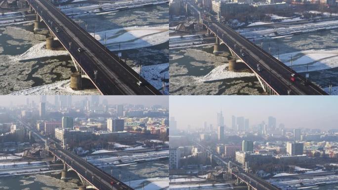 在寒冷的冬日，华沙市和维斯瓦河被冰和桥梁覆盖的无人机鸟瞰图