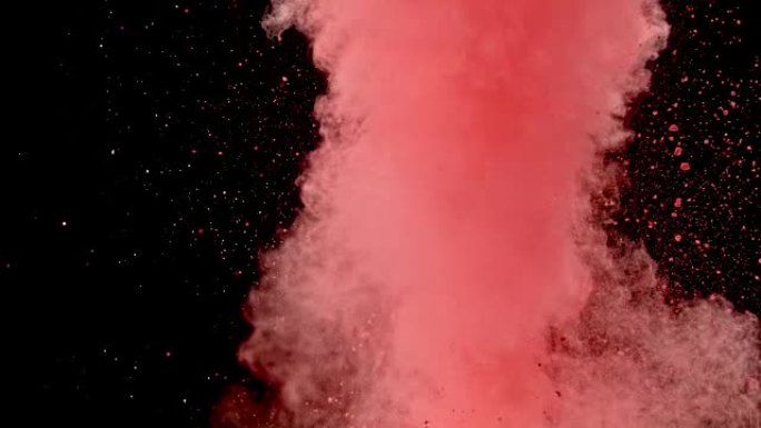 SLO MO红色粉末粉尘在黑色背景上直冲空中