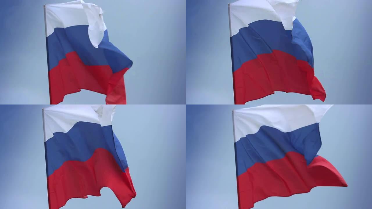 蓝天上飘扬的俄罗斯国旗。俄罗斯