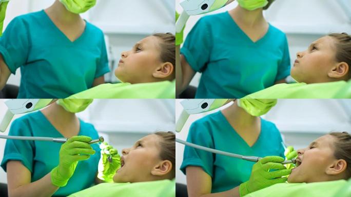 女牙医治疗小女孩的牙齿，抛光牙釉质，龋齿去除