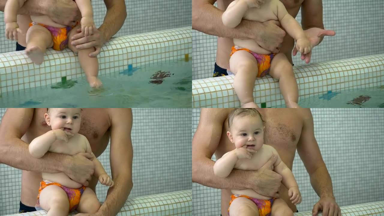 小男孩坐在游泳池边吮吸手指