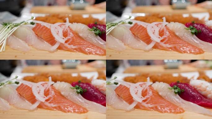 特写跟踪船上新鲜生寿司的照片，准备上菜。