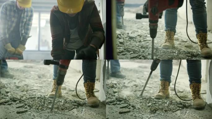 男女工人用手提凿岩机砍掉房屋中的水泥地板