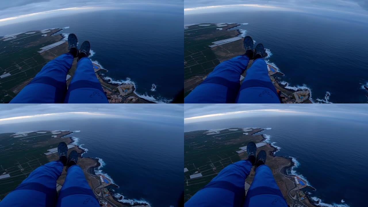 滑翔伞飞越海洋附近的沿海小镇的前视