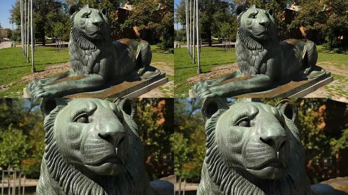 城市街道上躺着狮子的大雕像，动物的描绘，象征意义