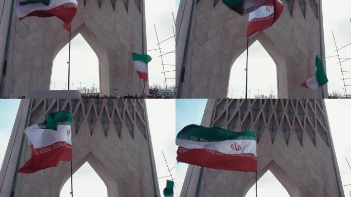 阿扎迪塔下举着伊朗国旗和标语牌的人们