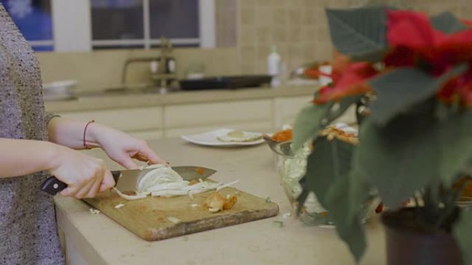 Girl cuts cabbage for salad