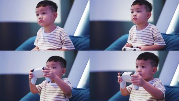 男孩使用游戏控制器在客厅玩视频游戏