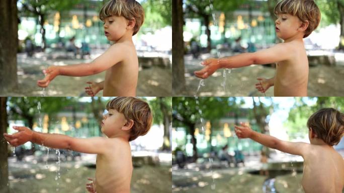 在炎热的夏日，孩子们在外面的公共水上公园喷泉洗手。儿童热天茶点。生活方式童年概念