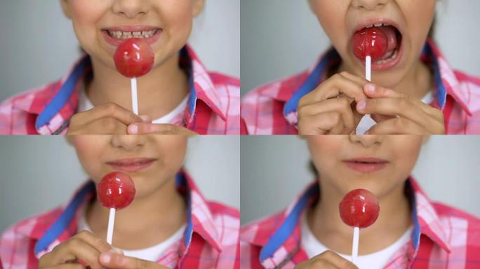 女孩试图咬棒棒棒糖，糖对牙齿的不良影响，牙齿护理理念