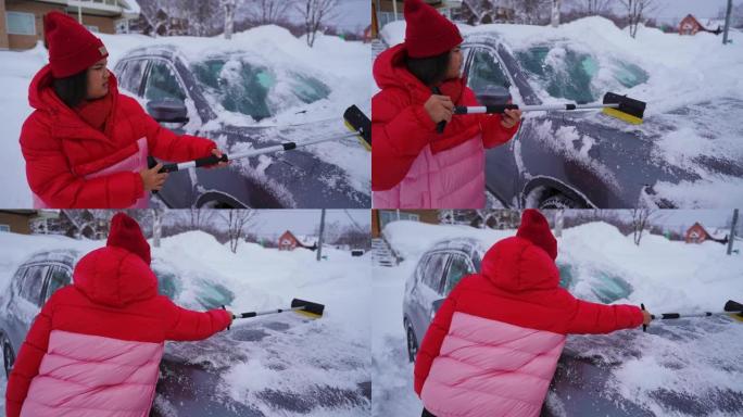 女人清理汽车上的积雪
