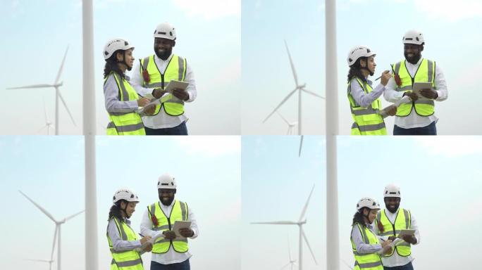 4k快乐的非洲工程师在风力涡轮机农场工作
