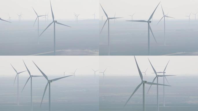 雾中风力涡轮机的鸟瞰图