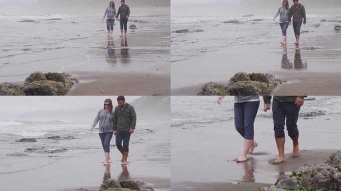夫妇一起在海滩散步。