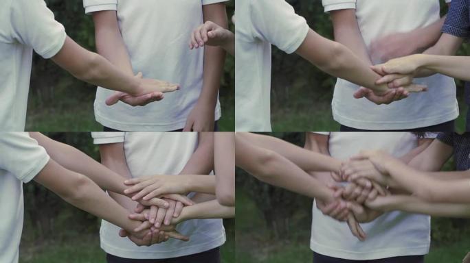 兄弟们在特写镜头中互相把手放在一起