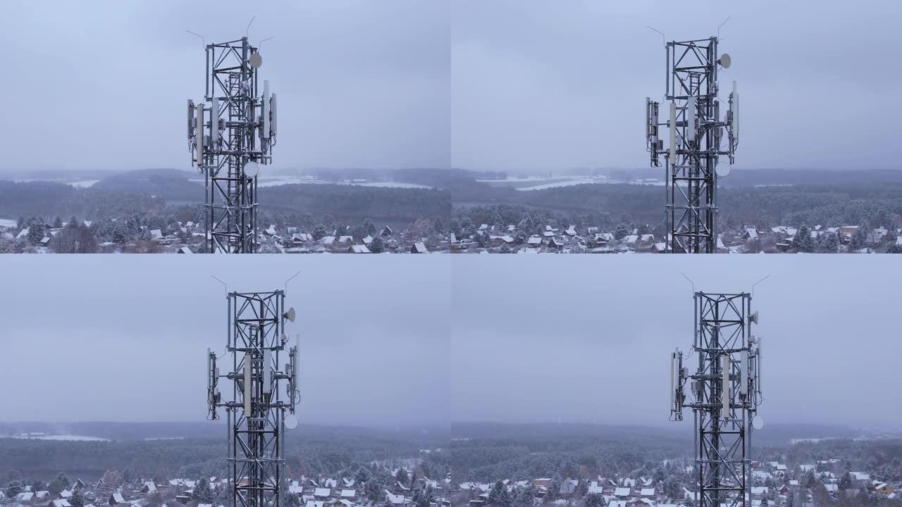 塔式天线电信手机的鸟瞰图，蜂窝5g 4g手机的无线电发射器。提供高速现代5g交通网络服务。雪自然森林