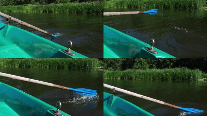 船漂浮在水面上。桨在水里。自然界中暑假的概念。