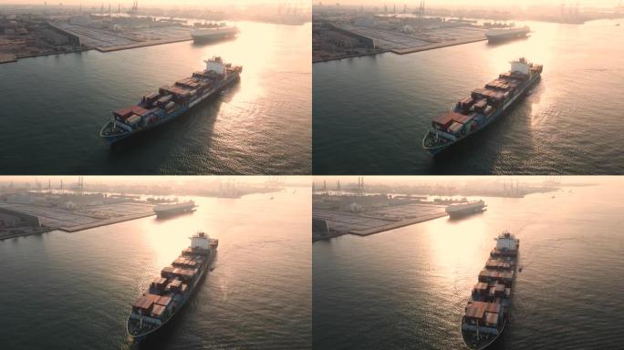 日出时在海洋中的集装箱船的航拍，飞越货运集装箱船，货运