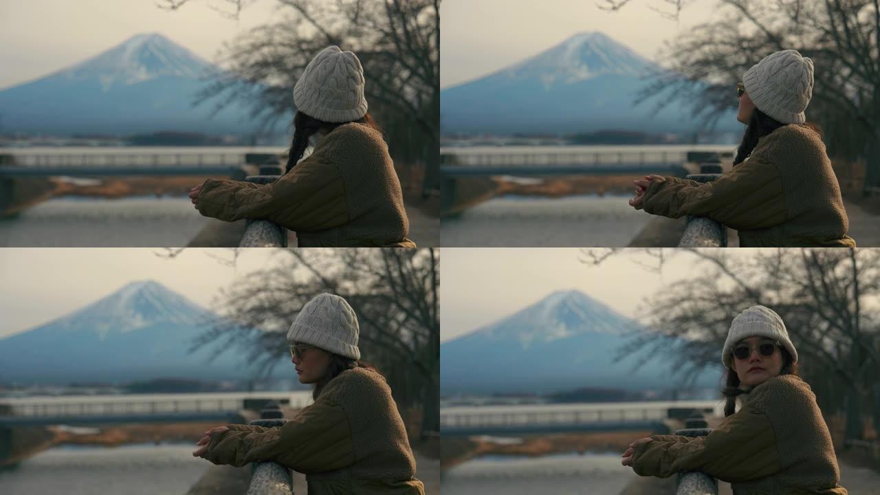 妇女在川口湖寻找富士山