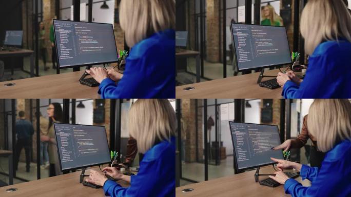 一组女性IT专家一起编写程序代码并讨论，在计算机显示上查看