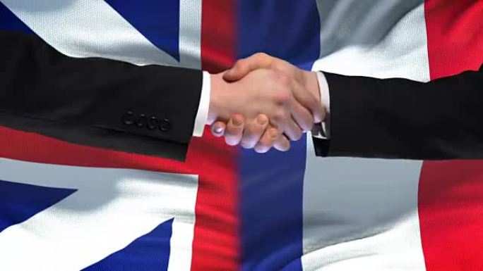 英法握手，国际友谊，旗帜背景