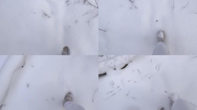 靴子在新鲜的雪中留下脚印。冬季在山区或森林中散步或远足。冬季户外活动