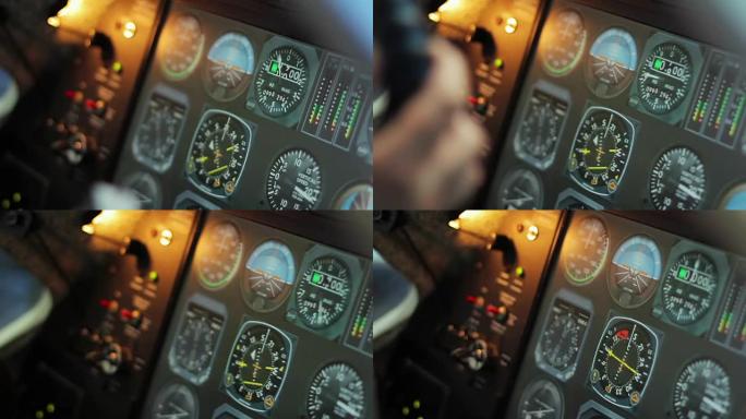 带变化指示器的飞行控制台，飞行员手放在方向盘上